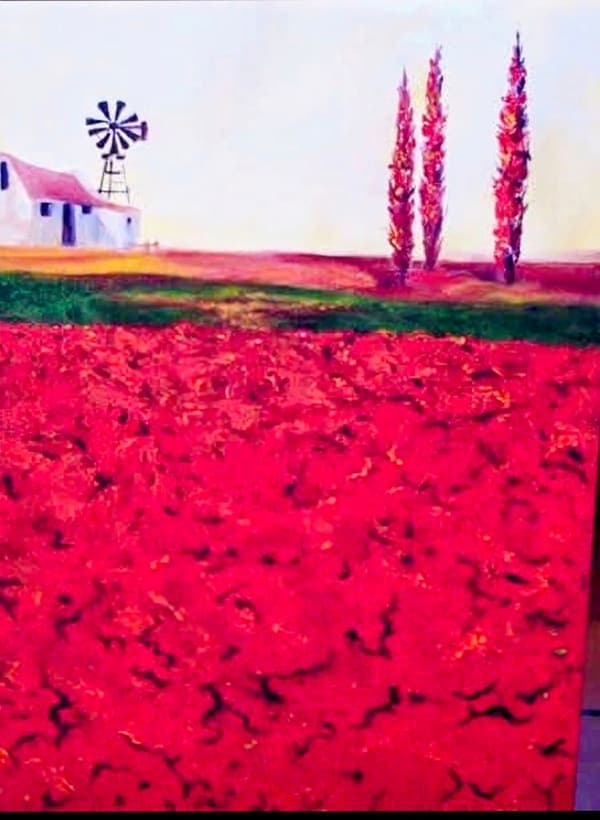 Red field with a windmill