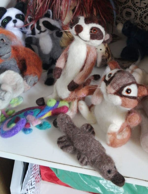 A shelf of felted friends