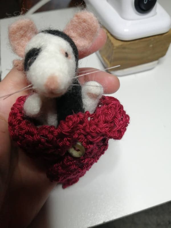 Mouse in a crocheted pocket
